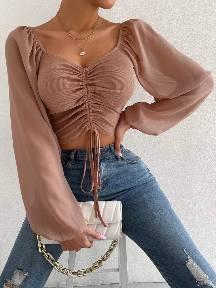 Women's top with puff sleeves and V-neckline