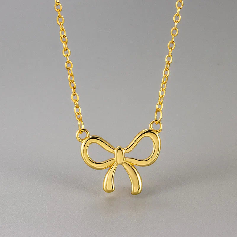 Women's copper necklace with cutout bow design