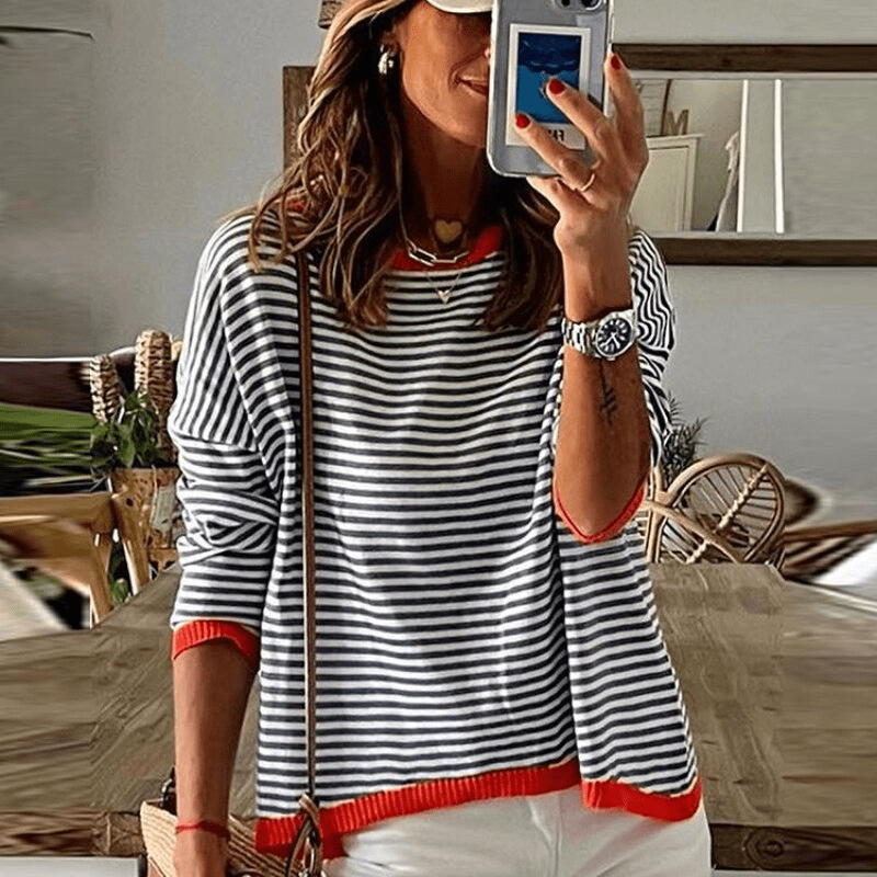 Blue striped sweater by Inès Lavigne with orange detailing