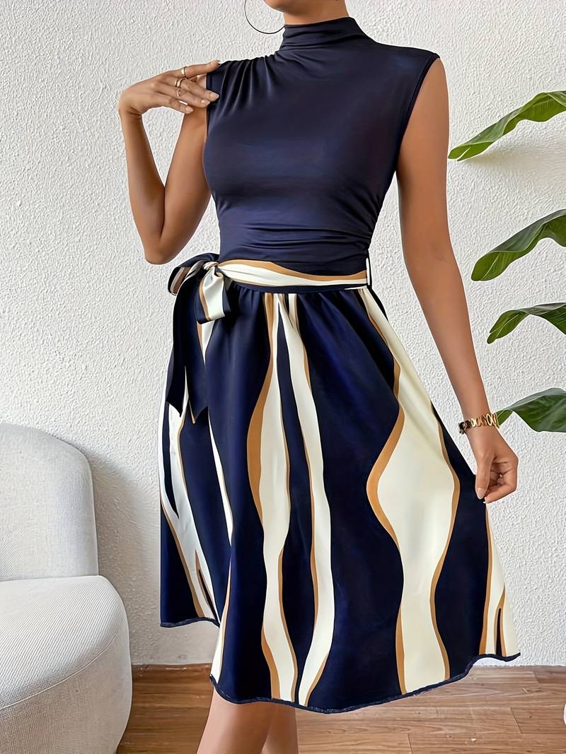 A stylish patchwork dress by Lucy, featuring a belt and striped print.