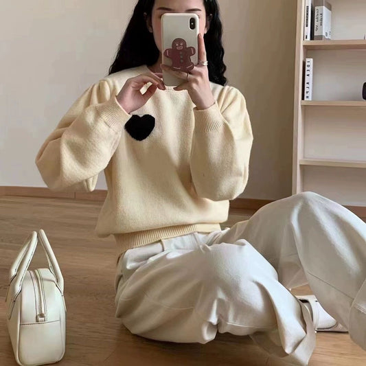 Women's knitted sweater with heart details