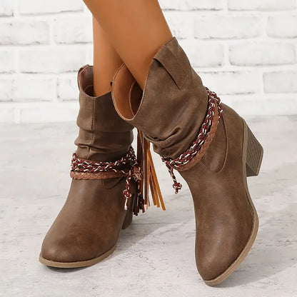 Women's cowboy boots with decorative lacing and fringes