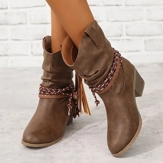 Women's cowboy boots with decorative lacing and fringes