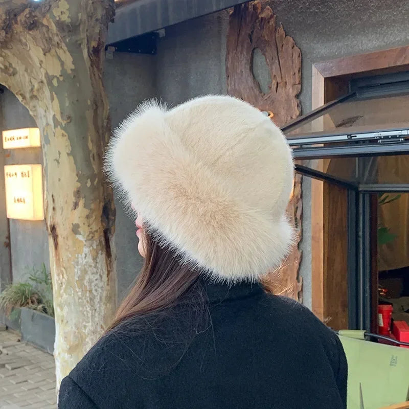 Warmer women's fur hat made of faux fur for autumn and winter