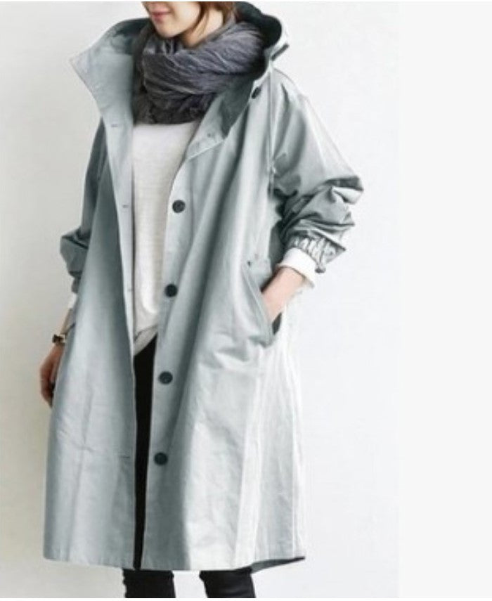 Women's coat with a hood and button closure