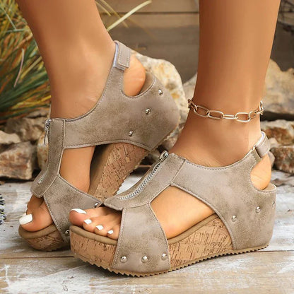 Wedge sandals with a zipper and decorative studs
