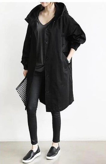 Women's coat with a hood and button closure