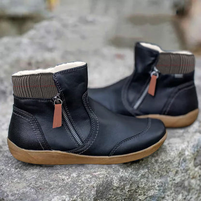 Black ankle boots with a zipper, insulation, and checkered detailing