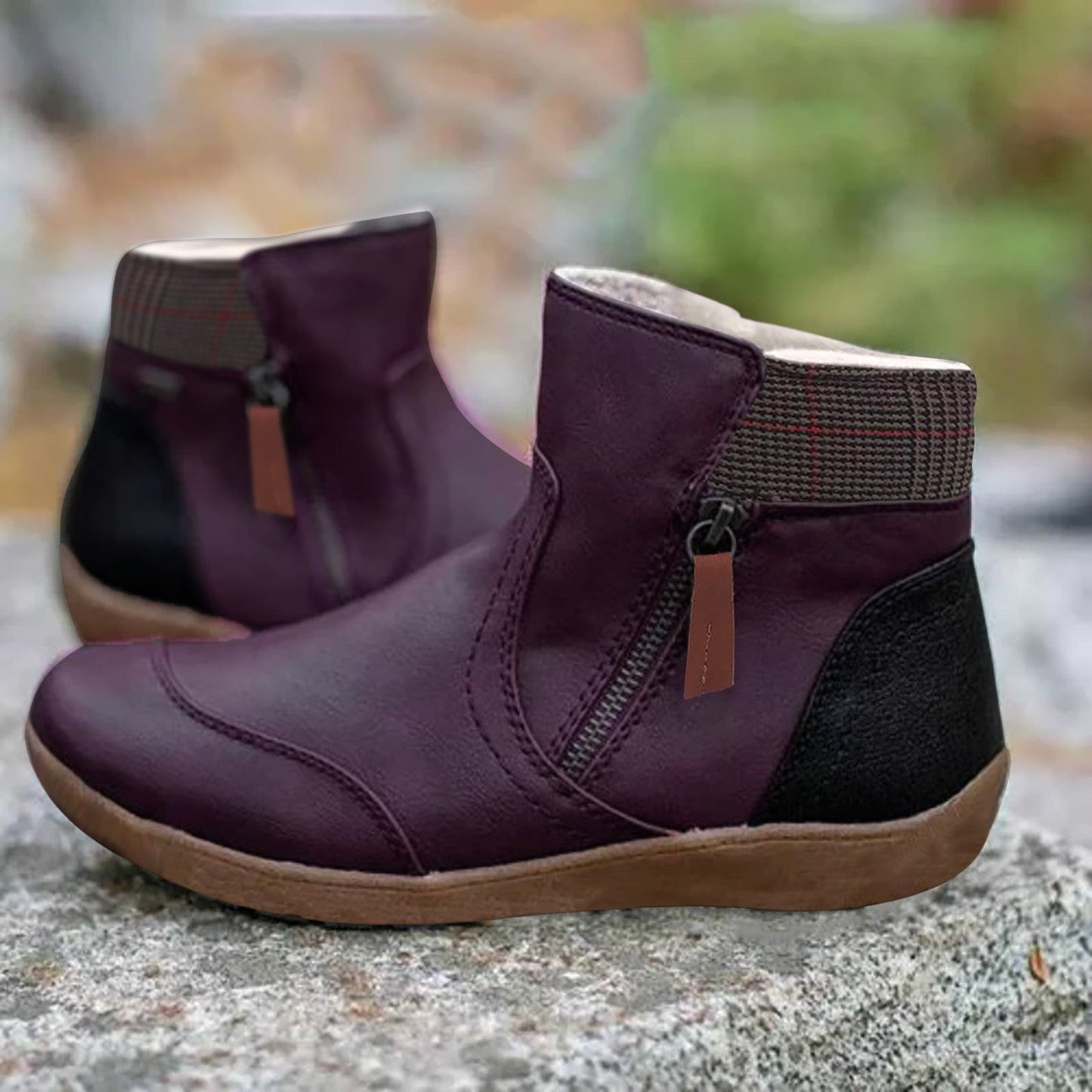 Black ankle boots with a zipper, insulation and checkered finish