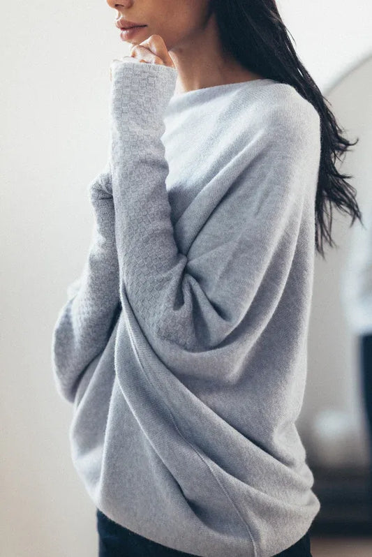 Asymmetric off-shoulder suspender sweater