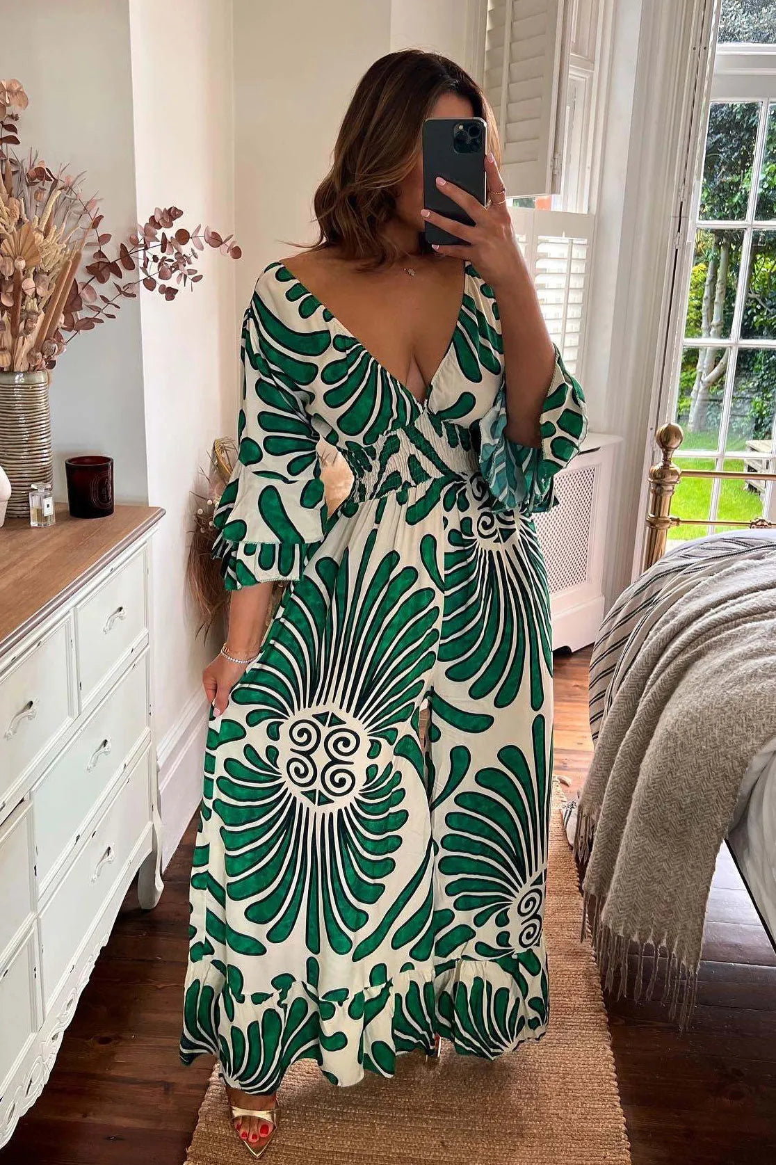 Vintage-style Sara jumpsuit with flounced sleeves and floral print